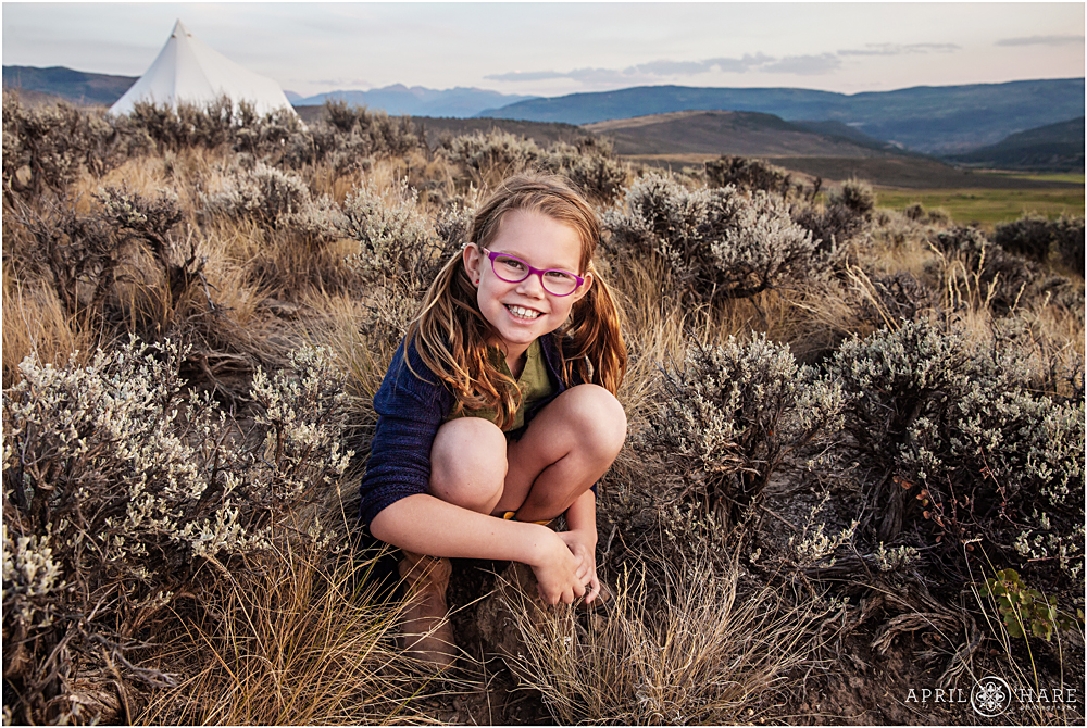 Pretty sunset light on a young girl at her family photography session in Vail