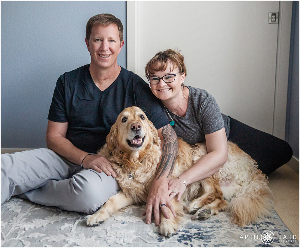 Couple poses at their home with their sweet dog in Louisville Colorado