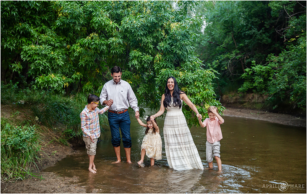 Colorado Family portraits splashing in Cherry Creek near Four Mile House