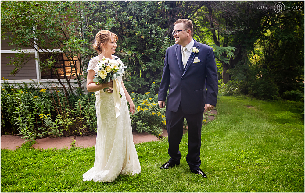 A happy and sweet first look moment at a Littleton garden wedding