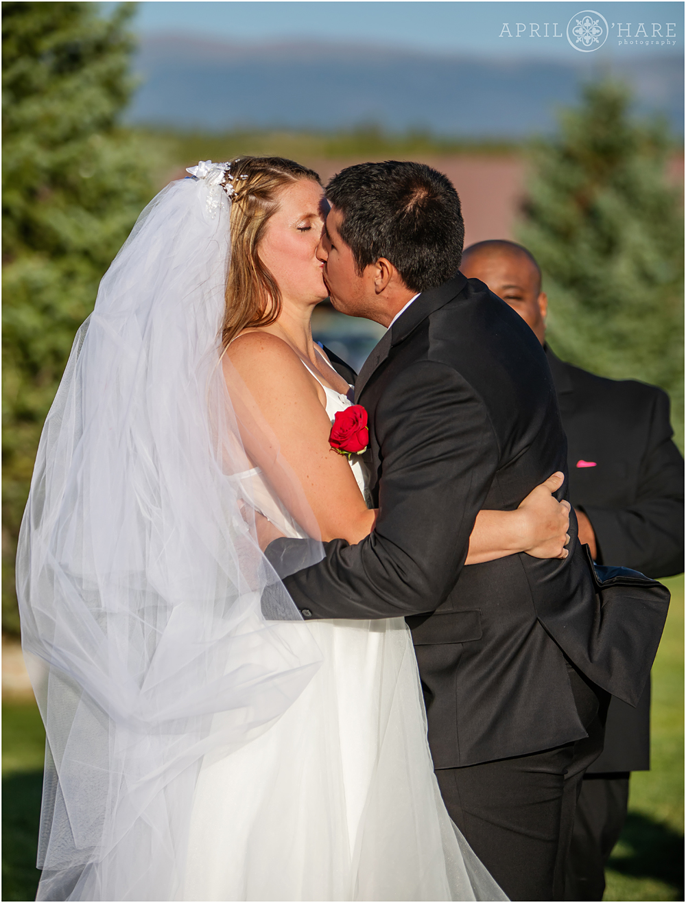 Wedding ceremony kiss at Snow Mountain Ranch YMCA of the Rockies in Granby