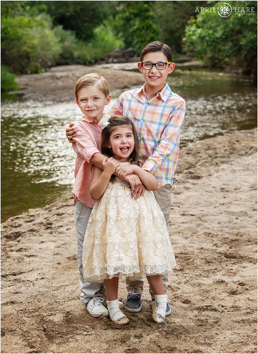 Sibling photos next to Cherry Creek at Four Mile Historic Park in East Denver