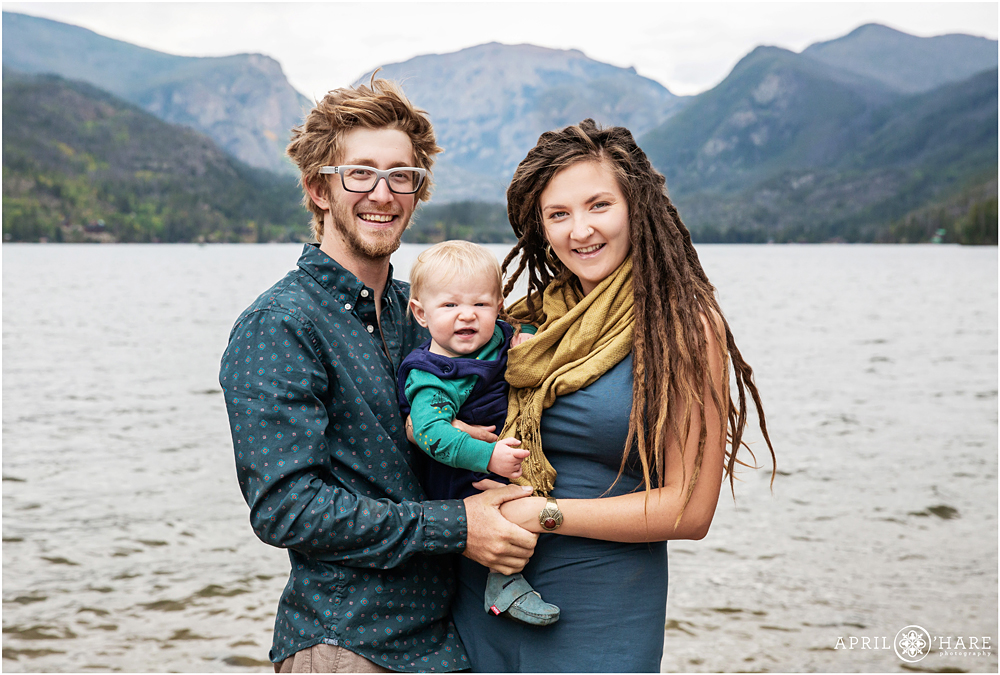 Cute family with baby boy and mountain backdrop at Point Park in Grand Lake Colorado