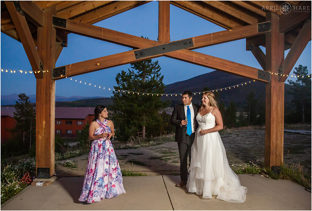 Wedding speech at dusk at Schlessman Commons Pavilion Snow Mountain Ranch
