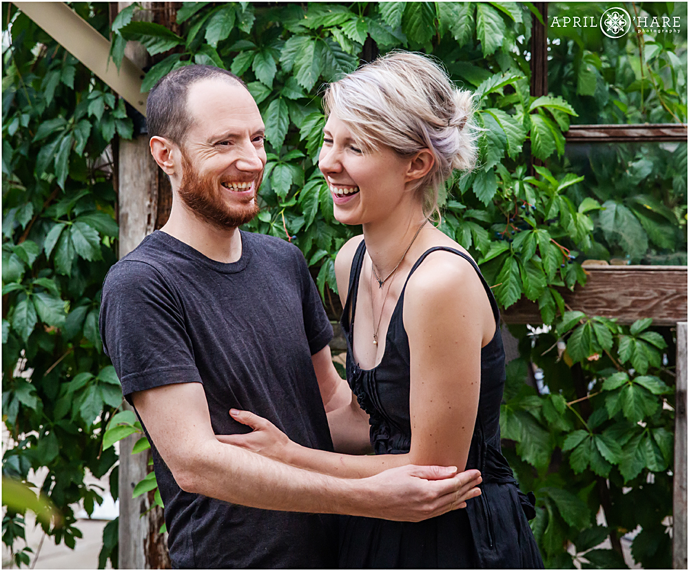 A laughing couple during their couples portrait session in Colorado
