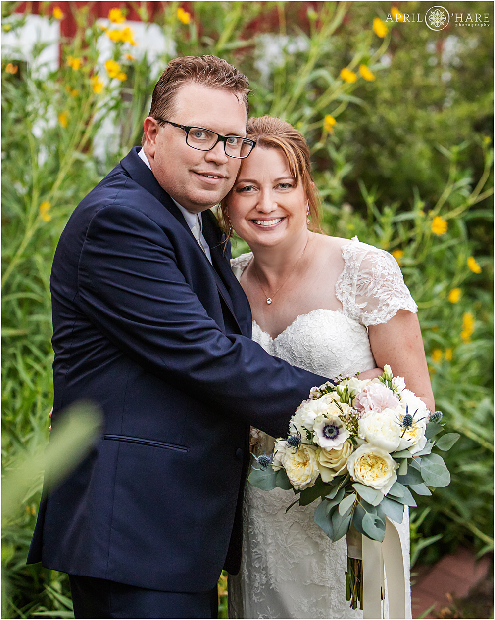 Wedding day portrait in the sunflowers at Chatfield Farms