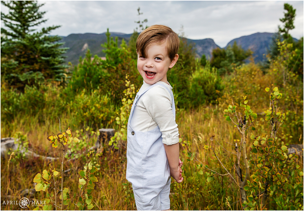 Cute little boy flirting with the camera at his family's Colorado photography session at Grand Lake