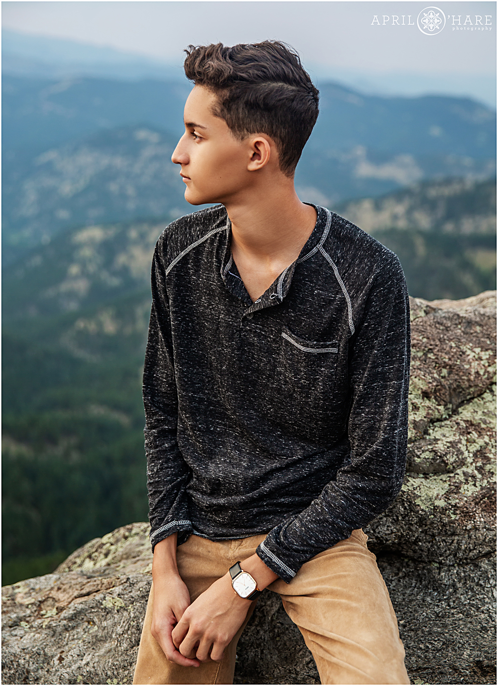 Cool photo of a high school senior looking off into the distance at Lost Gulch Overlook in Boulder