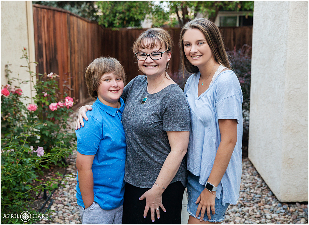 Stepmom with his stepkids during family photos at home in Colorado