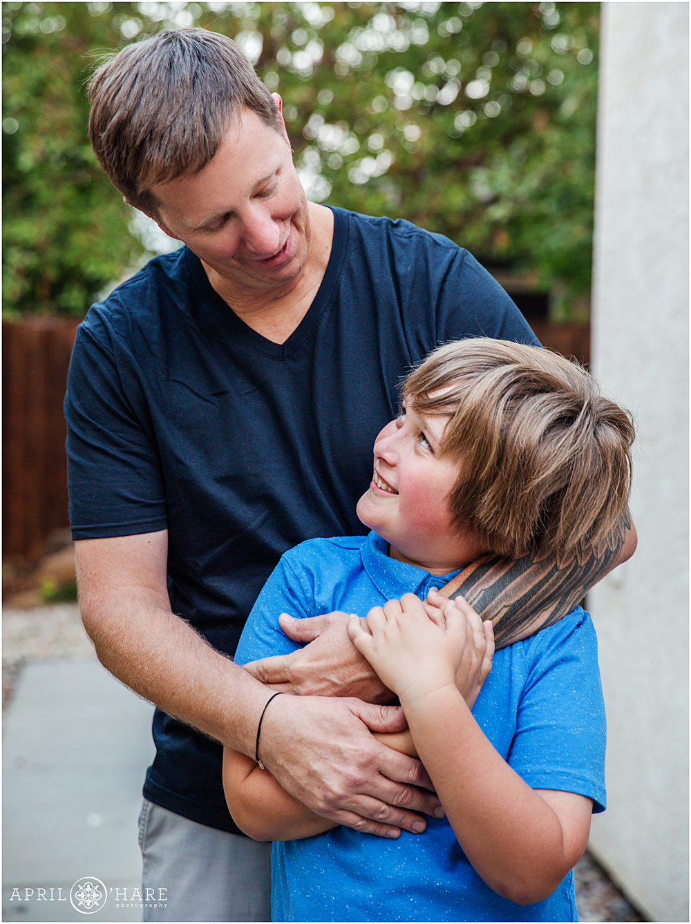 Dad with his son at their family home portrait session in Colorado