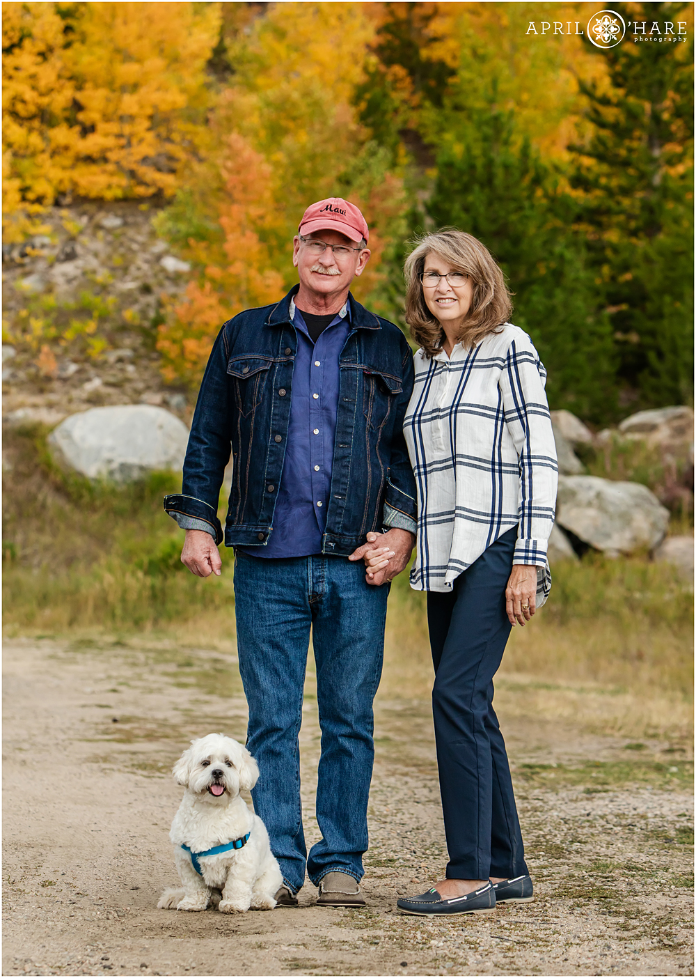 Mom and Dad with their little white dog during fall color at Grand Lake in Colorado