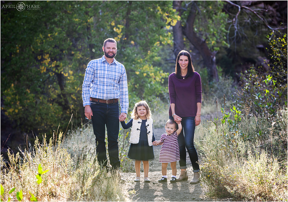 Pretty family photo on a pathway at The First Tunnel Walk in Golden Colorado