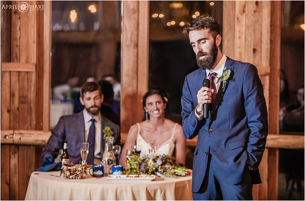 Wedding speech in a rustic barn at Wedgewood Weddings Mountain View Ranch