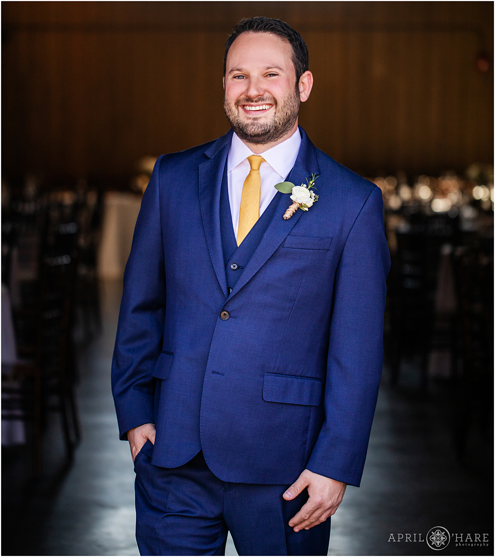 Groom portrait in front of the Barn at Raccoon Creek in Littleton Colorado