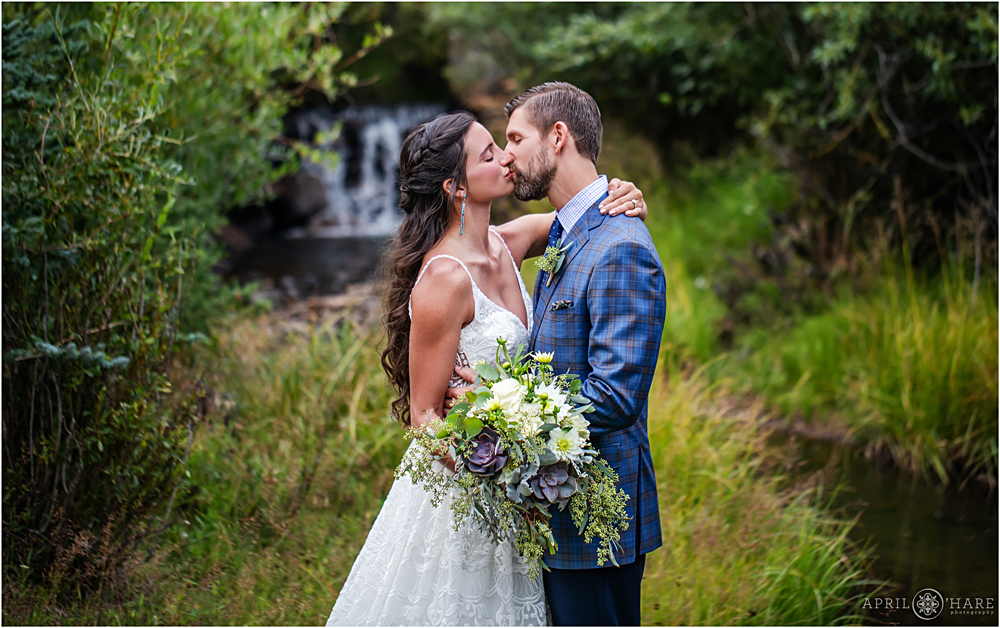 Romantic Rainy Wedding with waterfall backdrop in Colorado