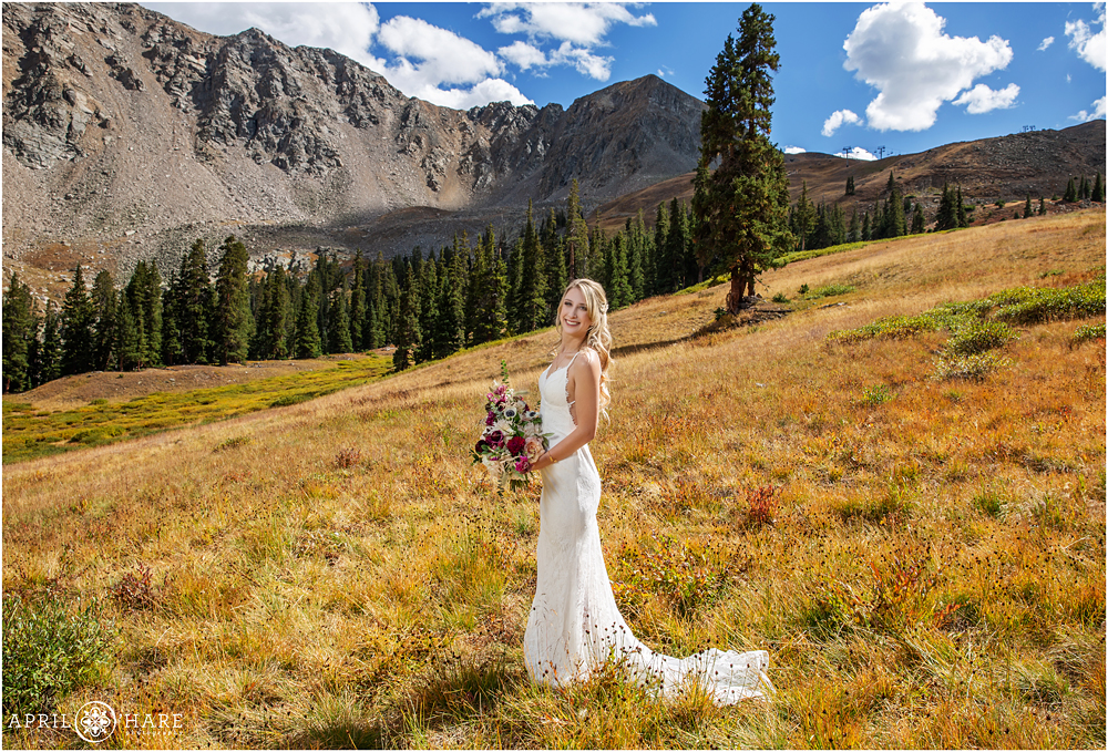 Beautiful sunny day bridal portrait in the mountains of Colorado