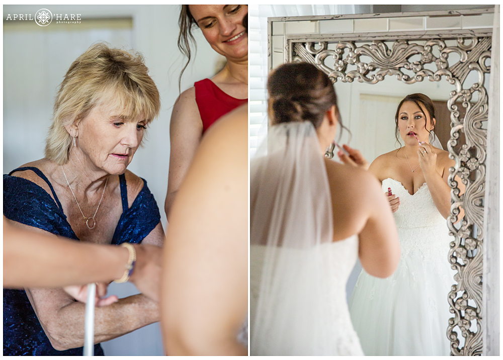 Bride's mom and friends help with her gown 