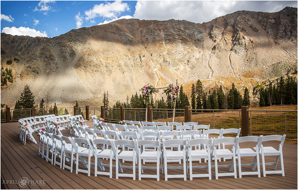Wedding ceremony set up on the deck at Arapahoe Basin Ski Resort on a fall wedding day in CO