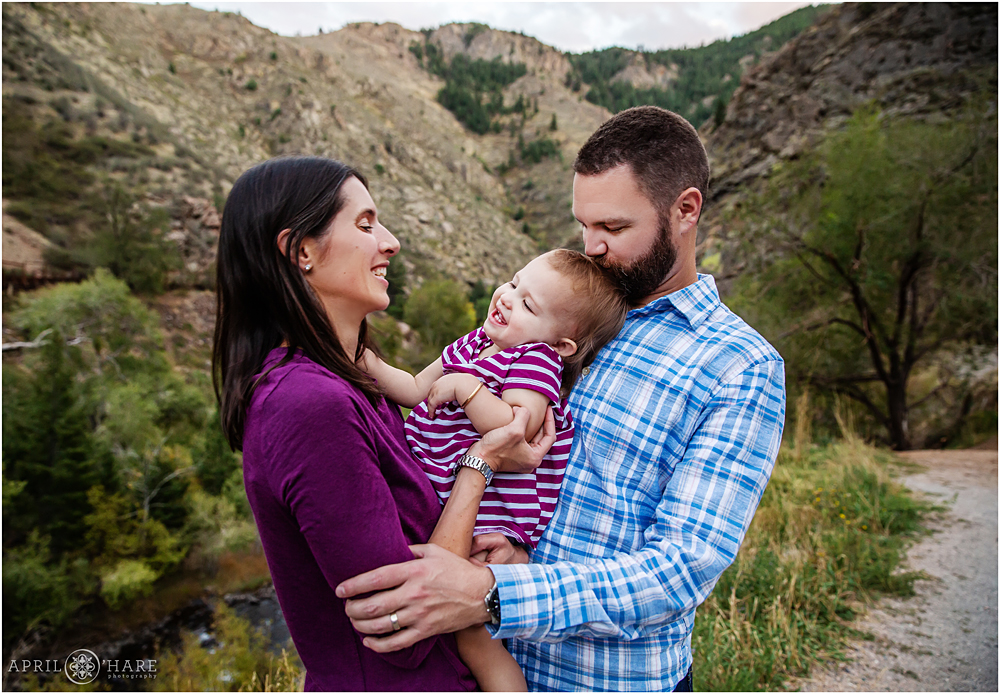 Baby girl gets some love from mom and dad in Clear Creek Canyon near Golden Colorado