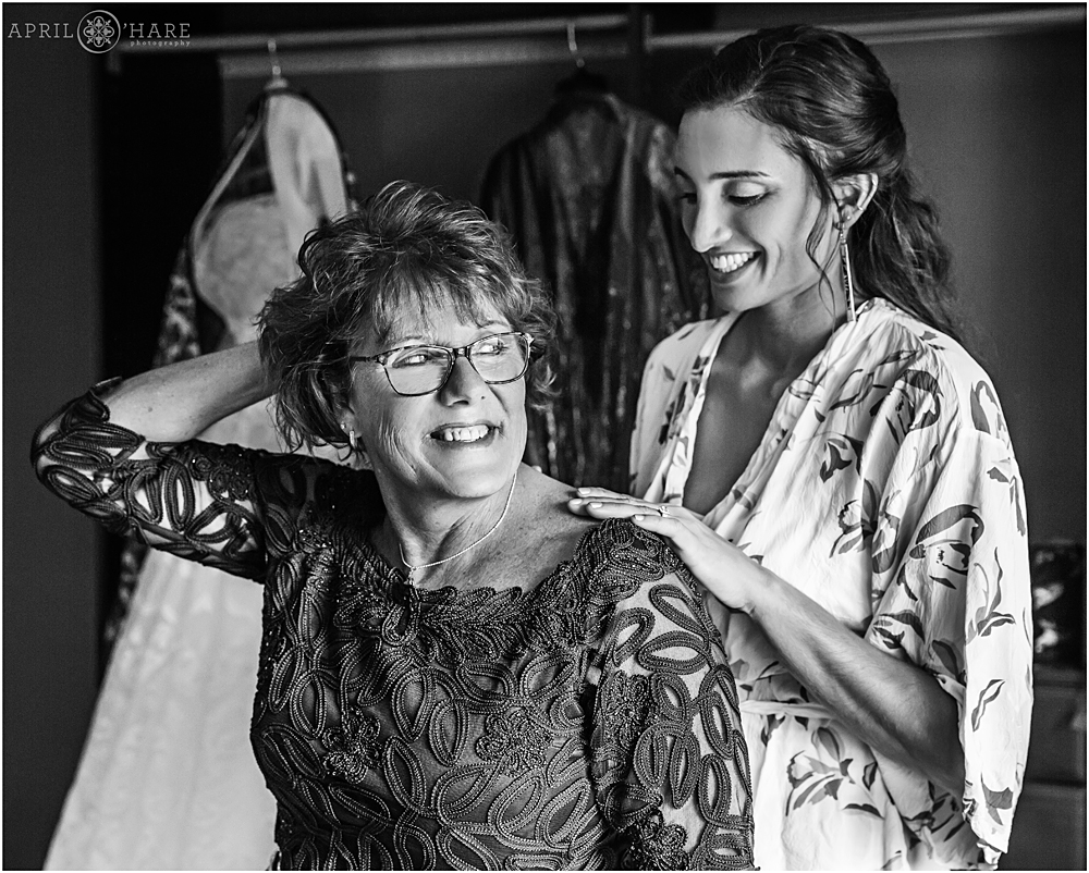 Bride helps her mom with her necklace at Wedgewood Weddings Mountain View Ranch