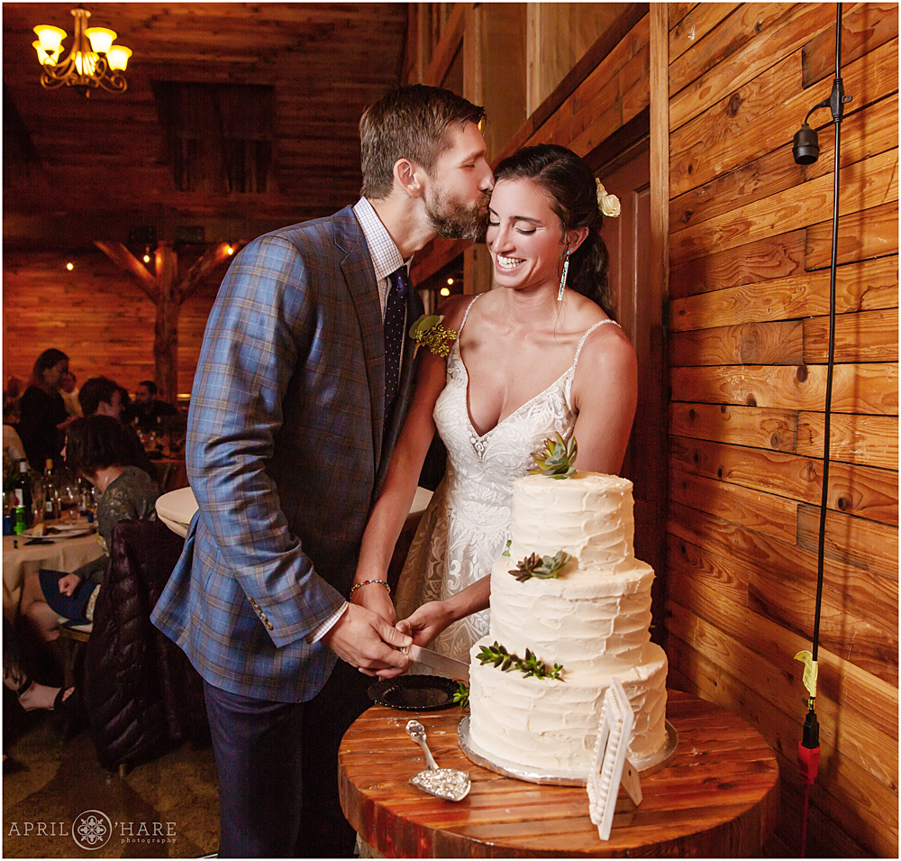 Cake cutting in the barn at Wedgewood Weddings Mountain View Ranch