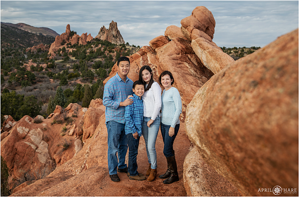 Beautiful fall family photo on the red rocks at Garden of the Gods in Colorado Springs
