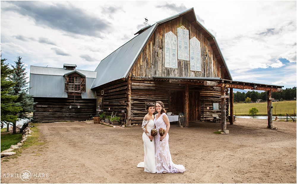 Two brides pose for a photo at their same sex wedding in Colorado