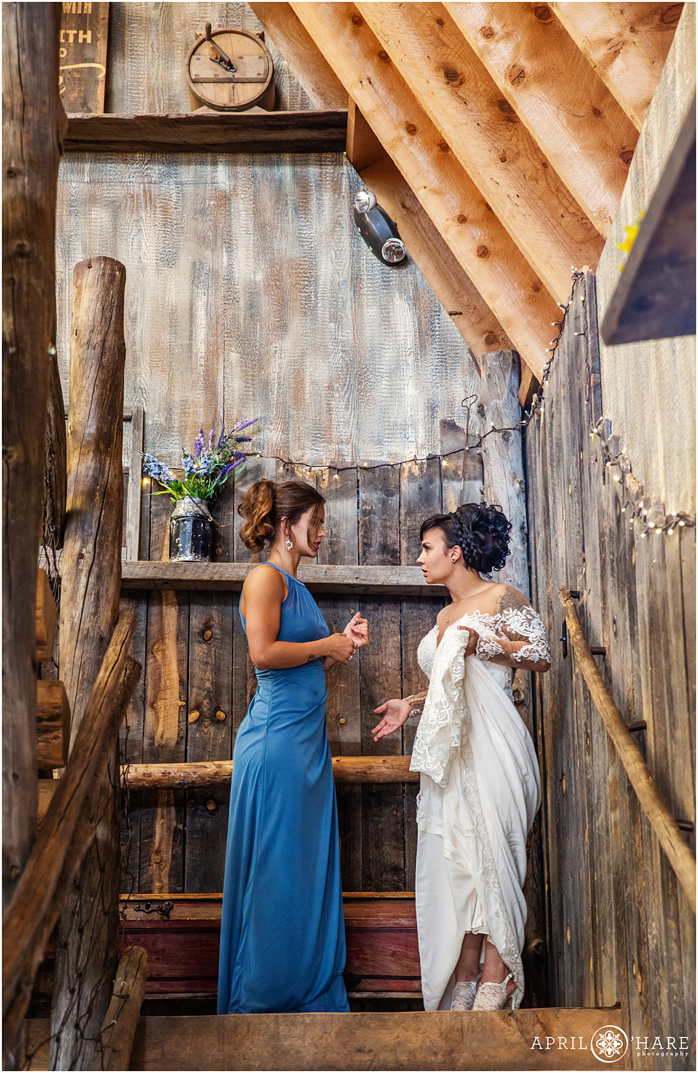 Sisters talk on the landing at The Barn at Evergreen Memorial Park in Colorado