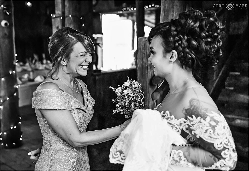 Mom and Daughter Moment at a Colorado Barn Wedding During Fall