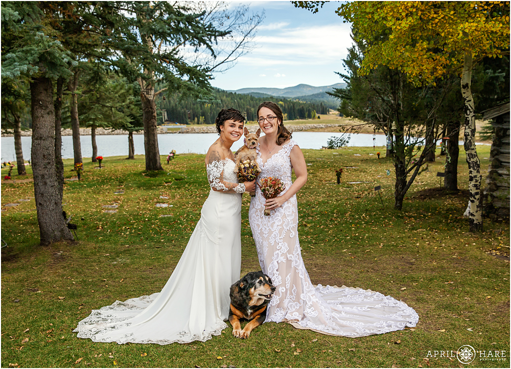 Two brides with their pet dogs on their wedding day at The Barn at Evergreen Memorial Park