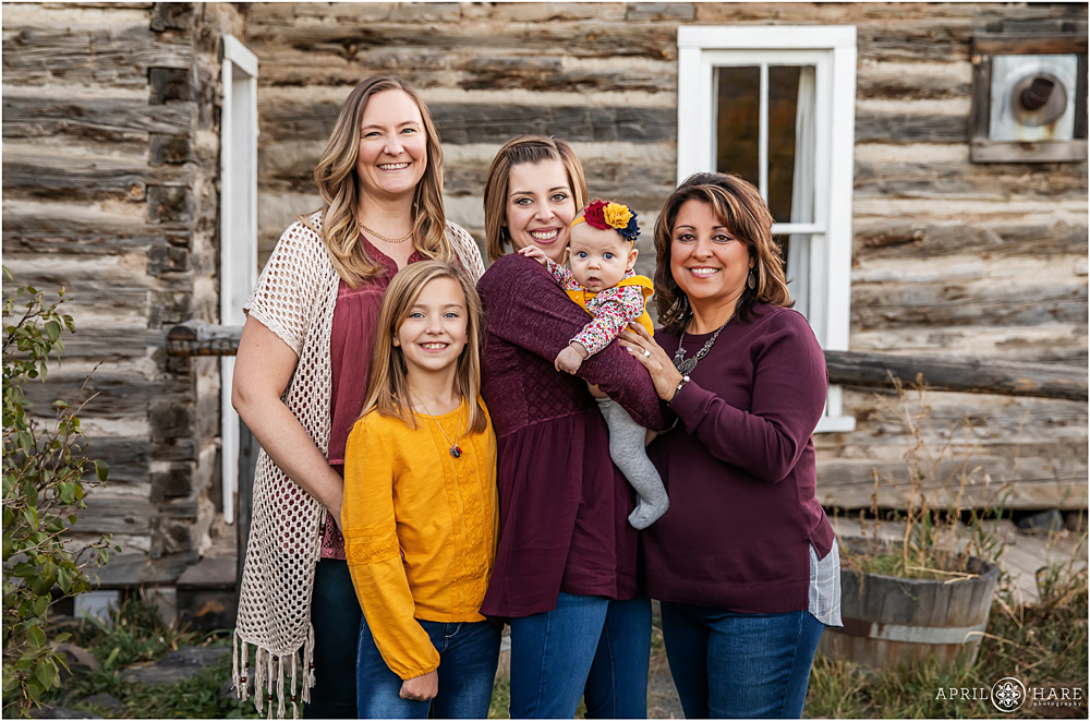 Just the ladies in front of rustic cabin at Extended family session in Colorado