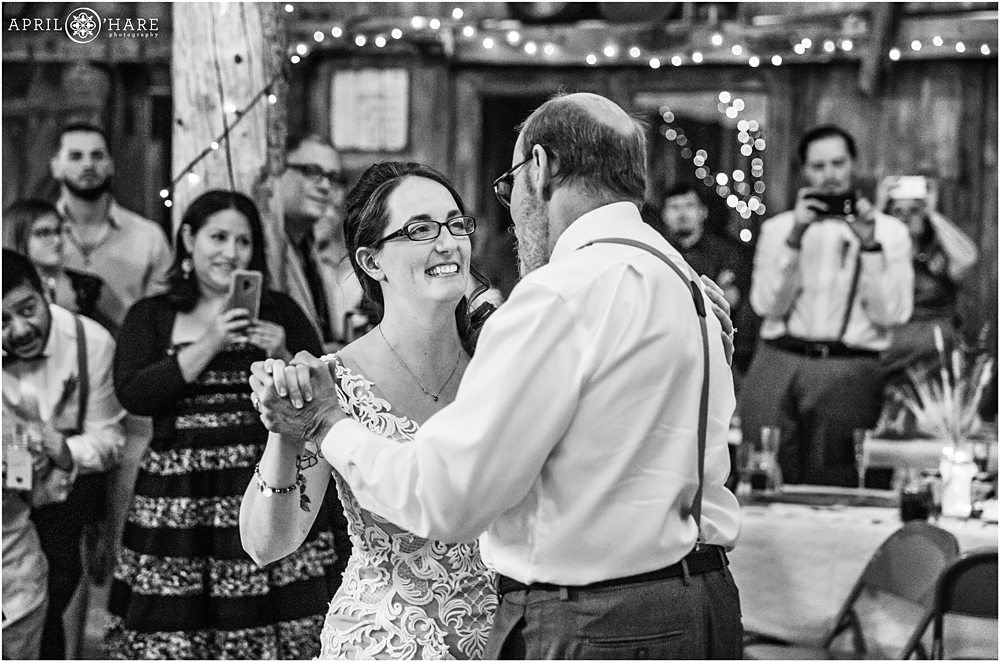 Father of the bride dances with bride on her wedding day in Colorado