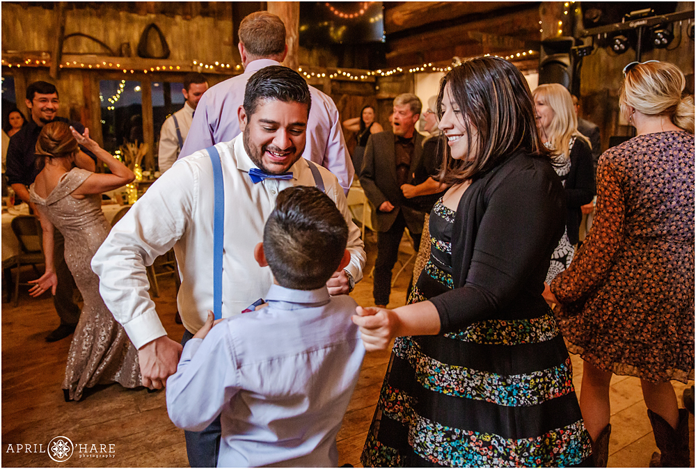 Wedding reception dancing inside rustic Colorado mountain barn