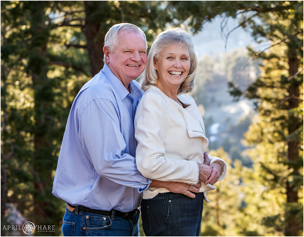 Grandma and Grandpa laugh together at Family photoshoot at Mount Falcon in Colorado