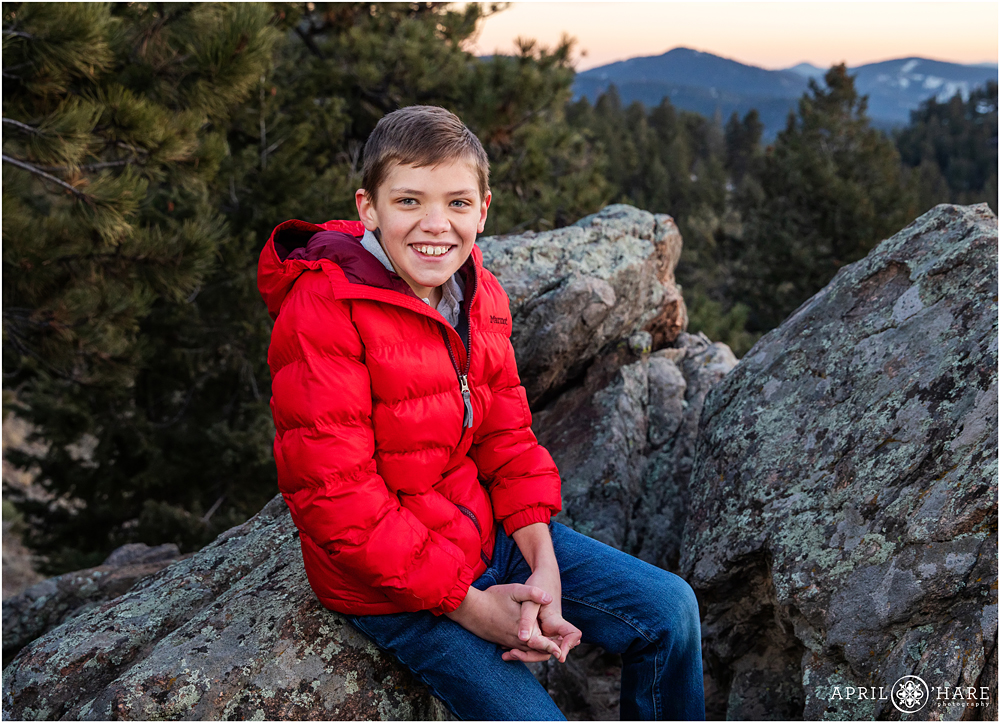 Classic portrait of a 12 year old boy at Mount Falcon with mountain backdrop in CO