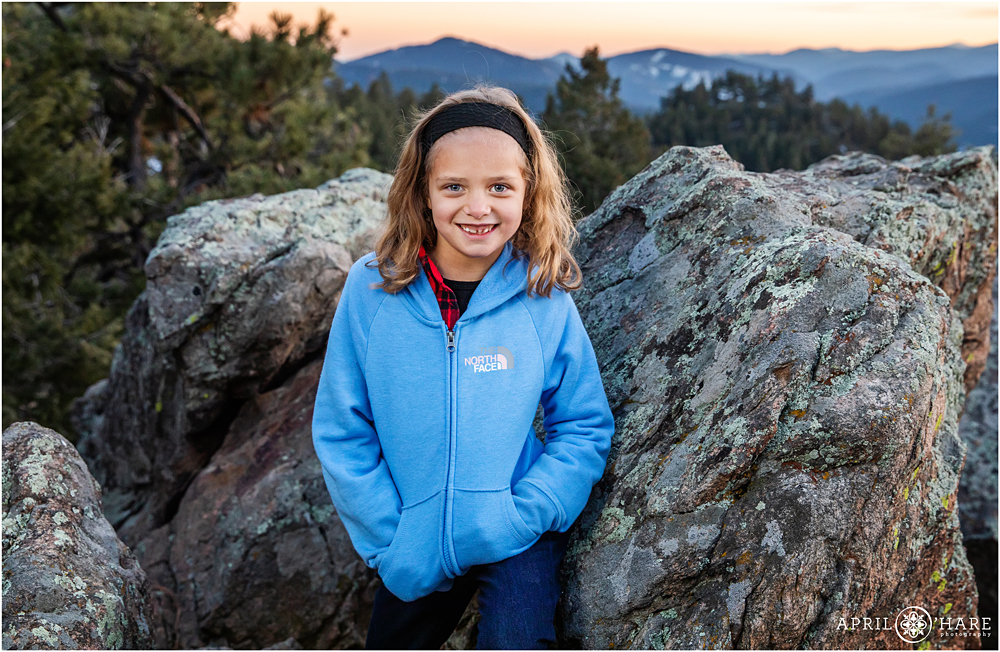 7 year old portrait at Mount Falcon in Evergreen with mountains