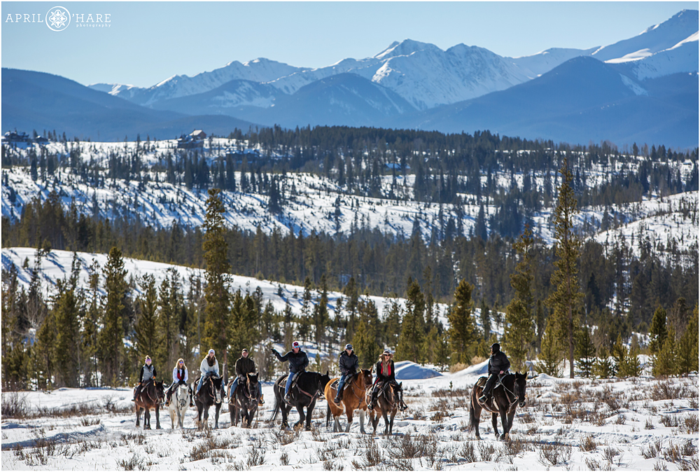 Family horseback ride during winter at Devil's Thumb Ranch