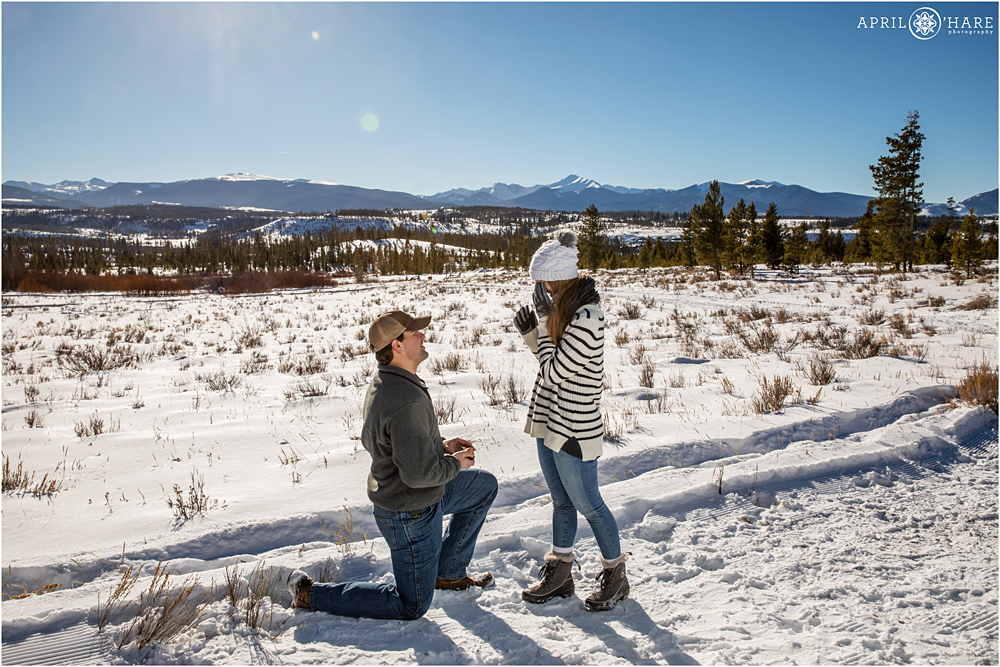 Surprise proposal in the snow at Devil's Thumb Ranch in Colorado