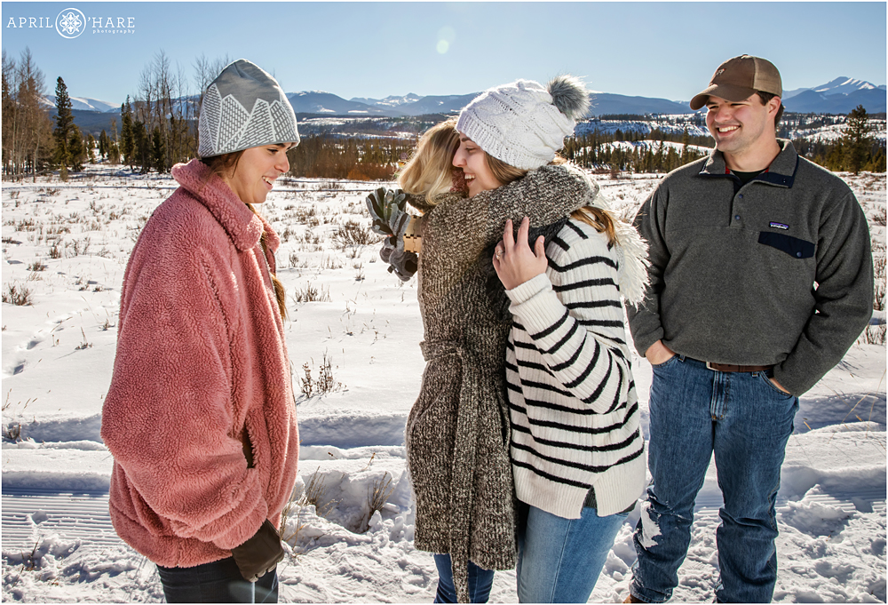 Family surprise at a proposal during winter at Devil's Thumb Ranch