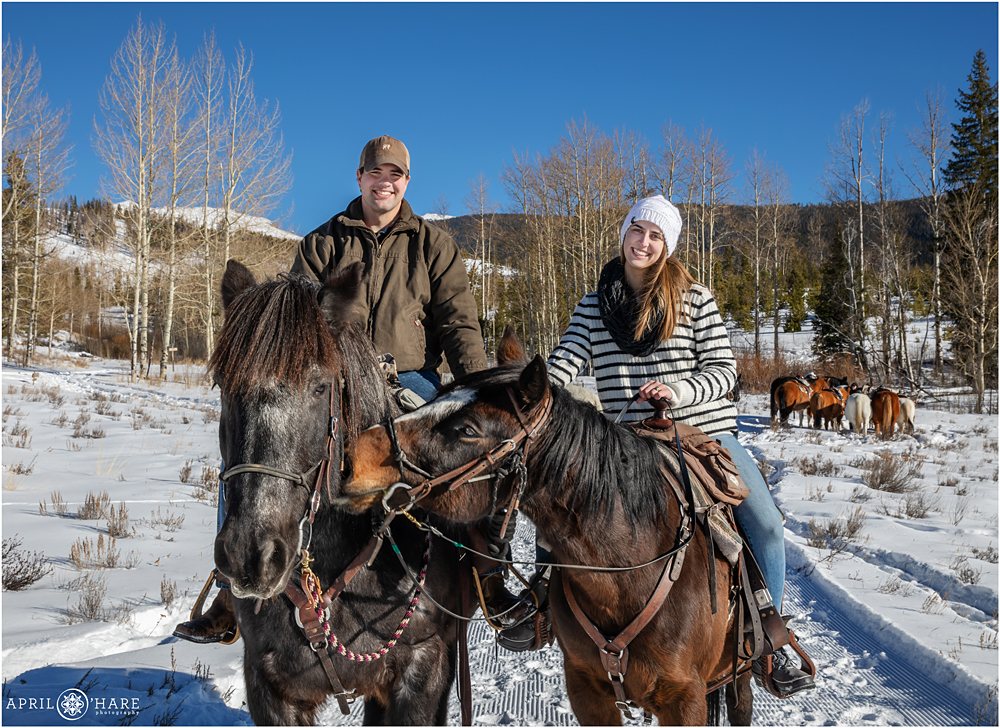 A horseback riding surprise proposal at Devil's Thumb Ranch during winter