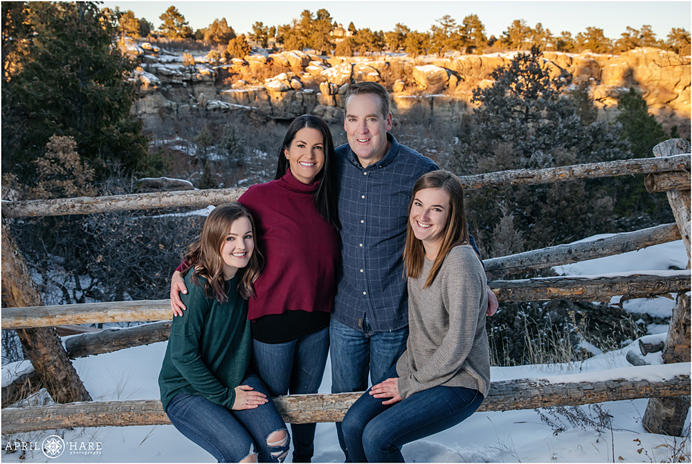Family photos with a ranch fence at Castlewood Canyon State Park