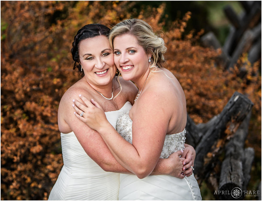 Beautiful Fall Wedding Portrait of Two Brides Embracing in Colorado