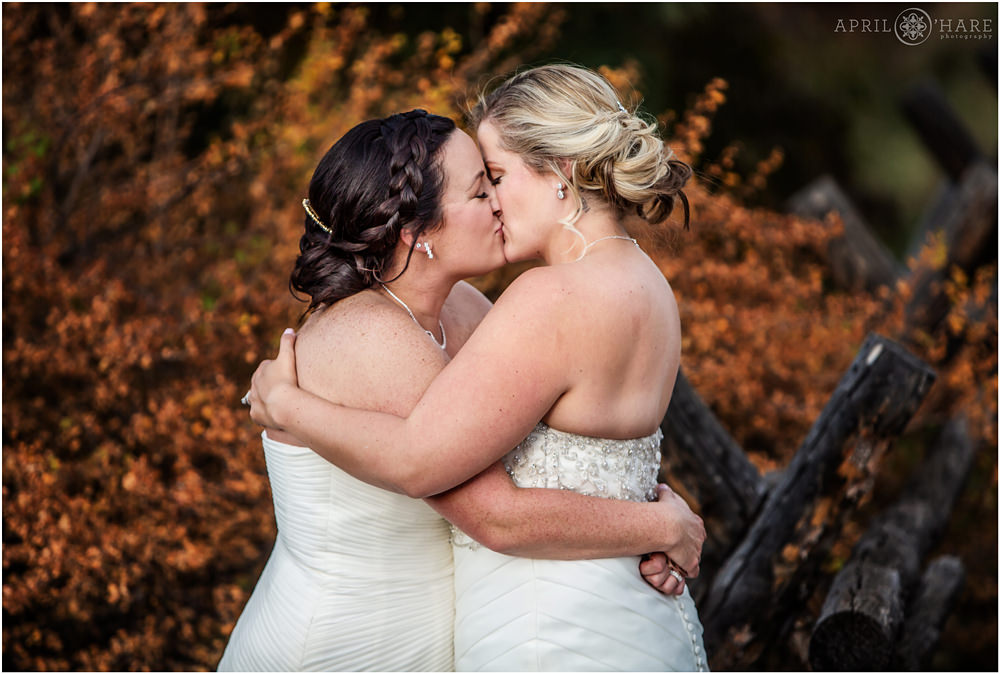 Sweet romantic lesbian wedding photo during fall color in Colorado