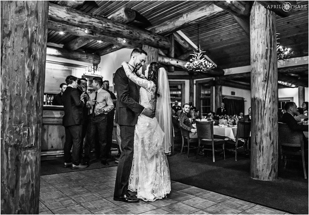 B&W photo of bride and groom first dance inside Alpenglow Stube Keystone CO