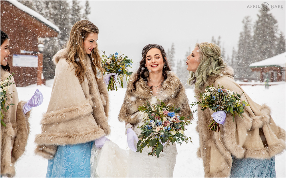 Bridesmaid blows snowflake off of her sister's eyelash at Keystone Resort in Colorado