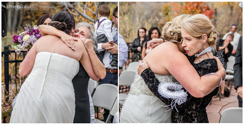 Brides hug their moms at their pretty Golden Hotel Wedding on the Patio