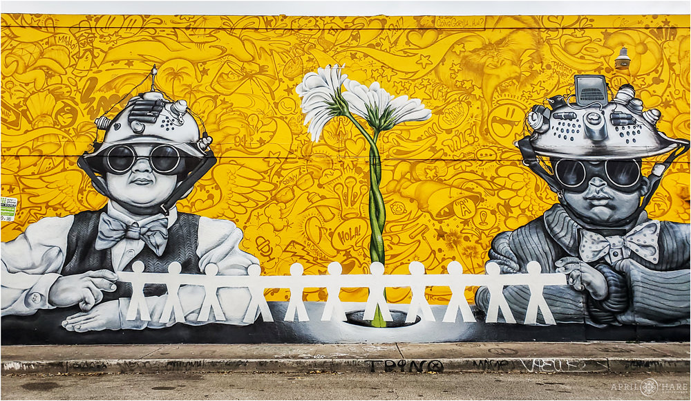 Awesome B&W Portraits on yellow street art wall mural in Wynwood Miami