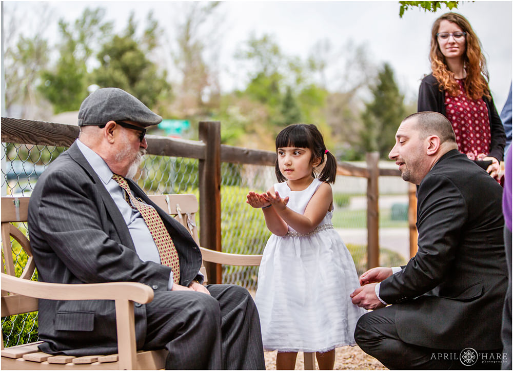 Young girl with grandpa at Bar Mitzvah in Colorado