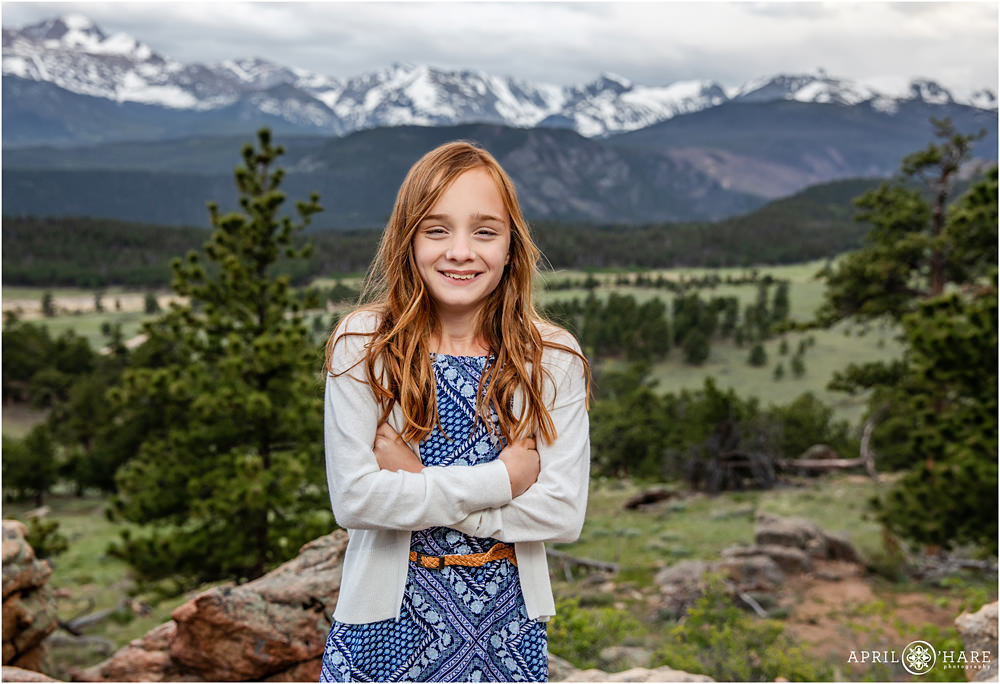 12 year old girl poses for a photo in Rocky Mountain National Park in Colorado