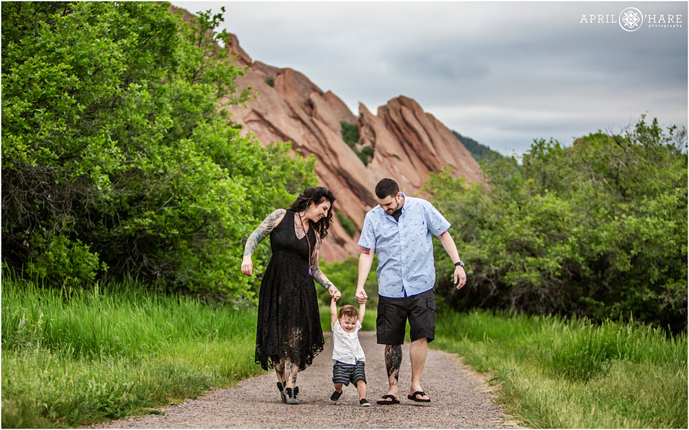 Family walks along the Fountain Valley Trail at Roxborough State Park in Colorado